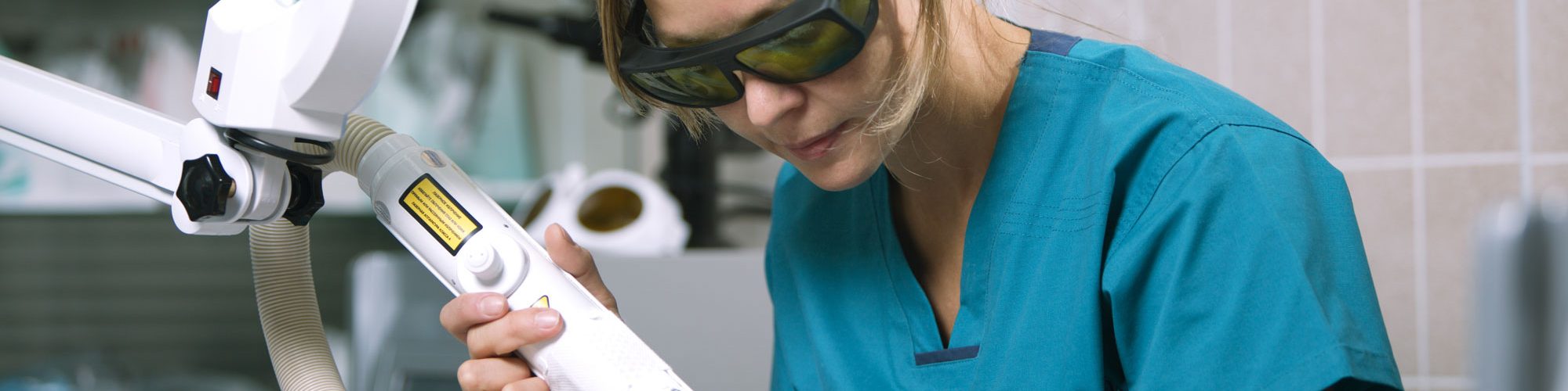 Woman undergoing laser skin treatment